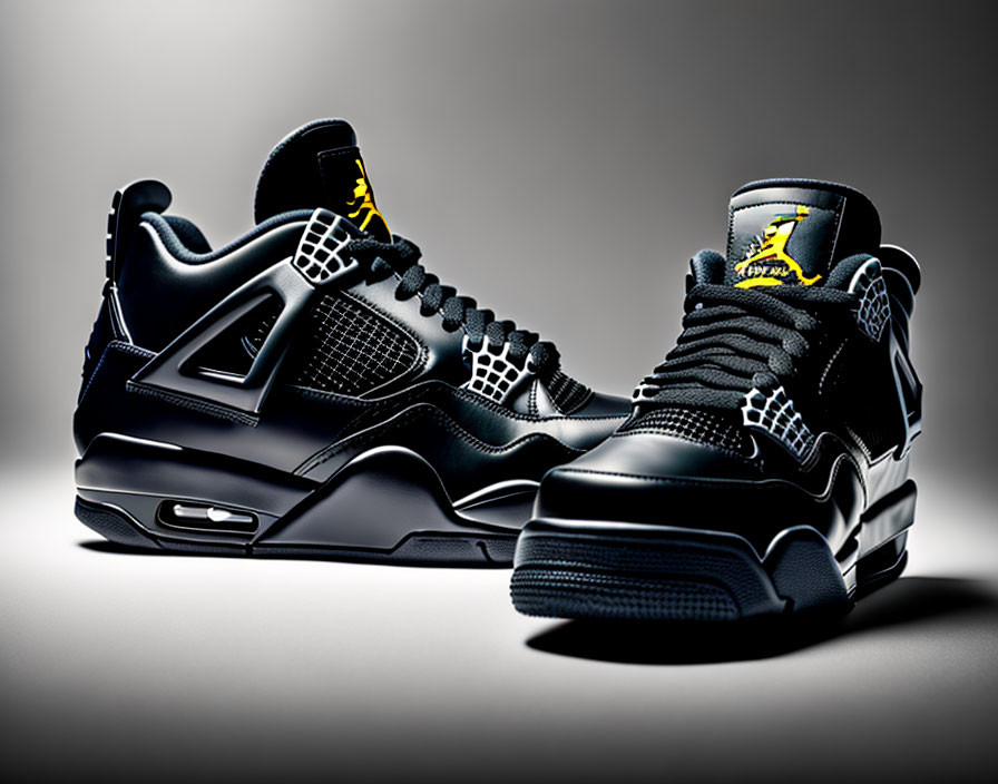 Black High-Top Sneakers with Yellow Accents on Gray Background