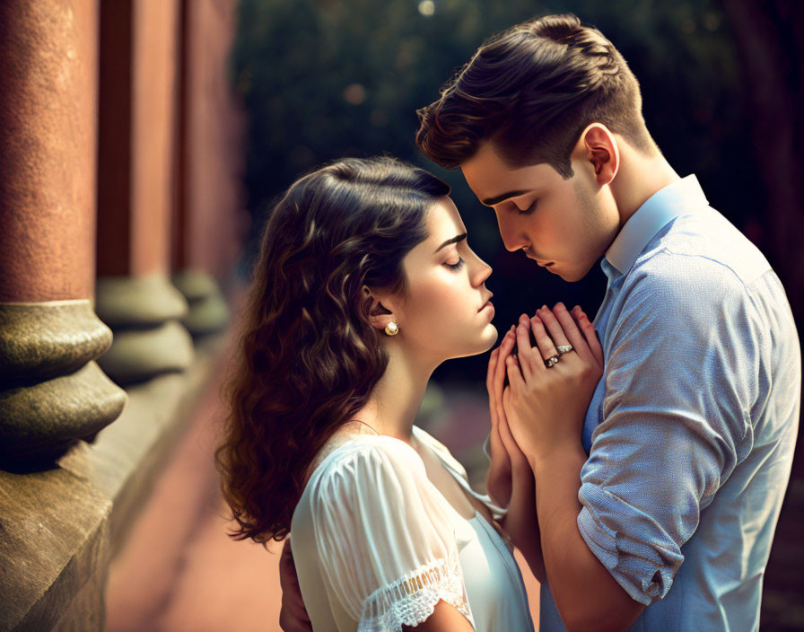 Couple embracing tenderly outdoors in close proximity