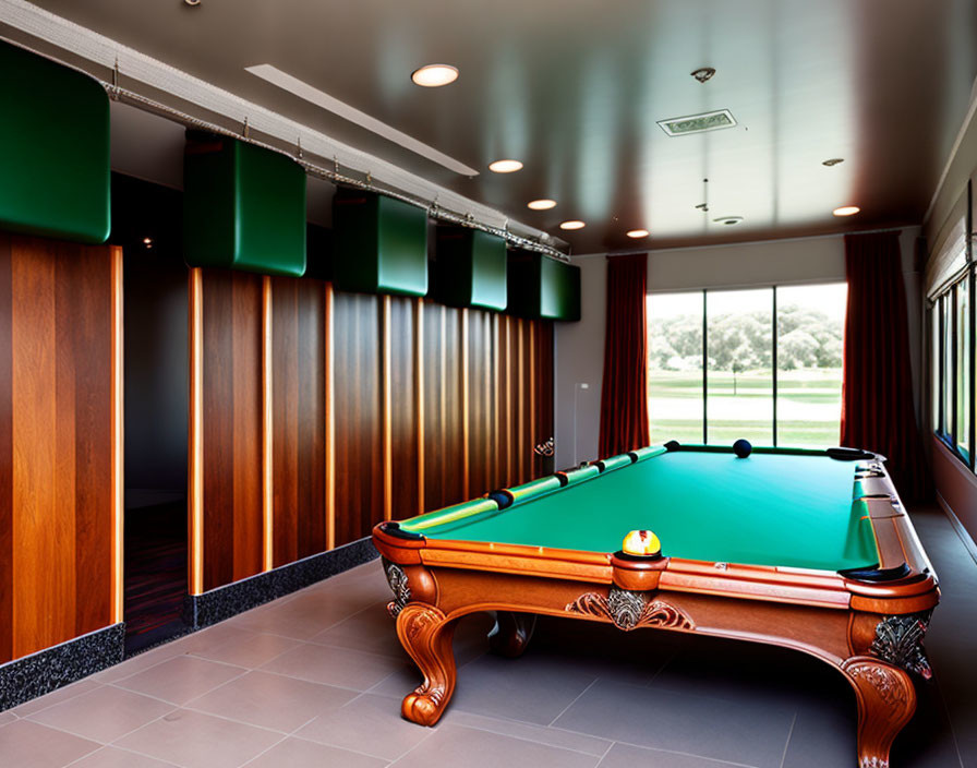 Sophisticated pool room with green-felt billiard table and ornate wooden accents