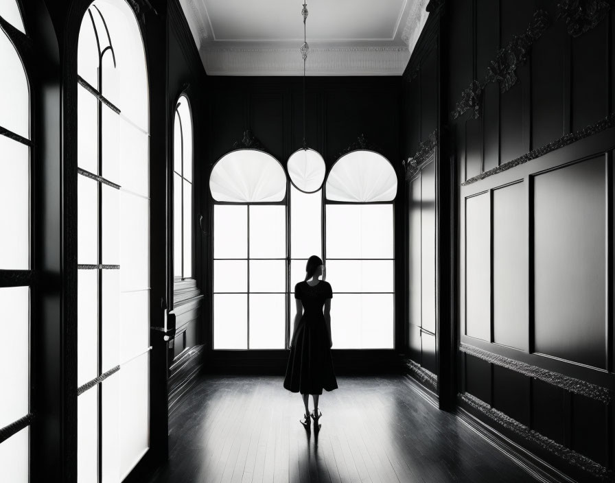 Silhouetted Woman in Room with Bright Windows