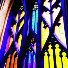 Colorful Gothic arches in cathedral with vibrant stained glass windows