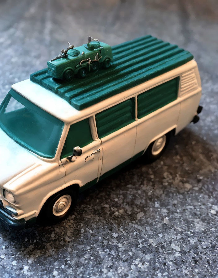 Vintage Toy Van with Green and White Color Scheme and Toy Car on Roof