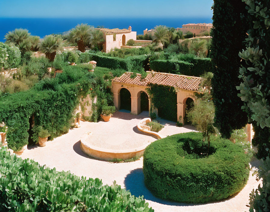 Tranquil Mediterranean garden with lush greenery and ocean backdrop