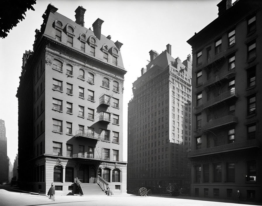 Historic street corner with early 20th-century buildings and horse-drawn carriages