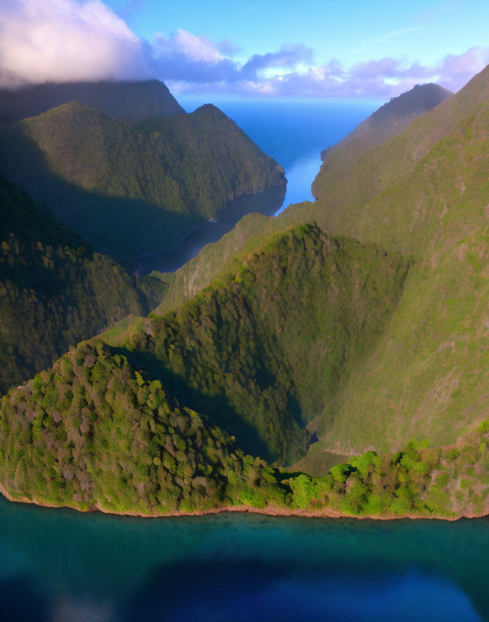 Scenic Aerial View: Green Valley, Mountains, Blue Sea at Dawn