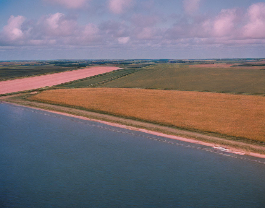 Colorful Patchwork Fields Along Winding River