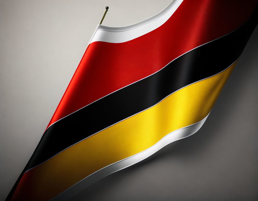 Close-up of wavy German flag with black, red, and yellow stripes on grey background