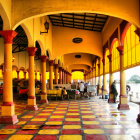 Luxurious Hall with Ornate Pillars and Traditional Robes