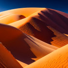 Expansive orange sand dunes with figure walking under clear blue sky