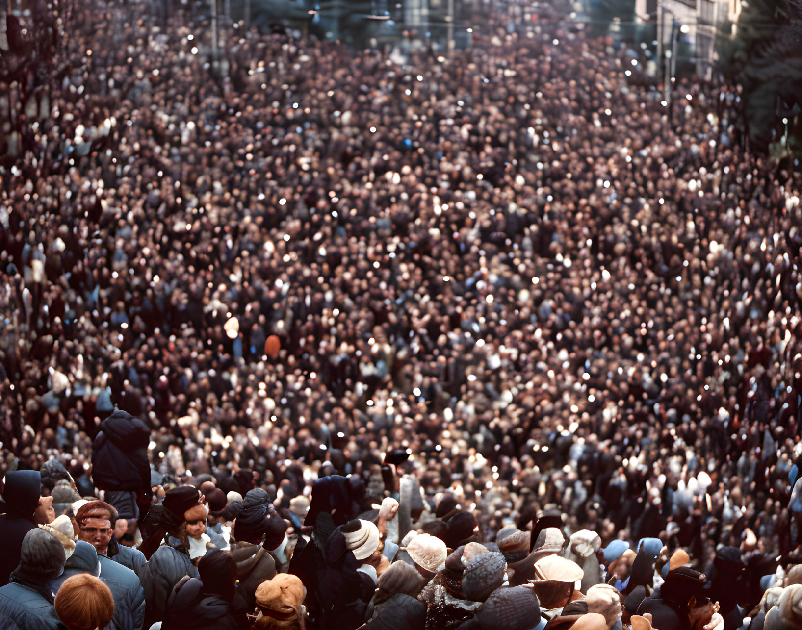 Crowded gathering with many people wearing hats