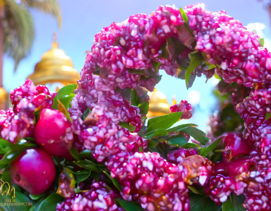 Pink Floral Wreath with Green Leaves and Golden Temple Domes