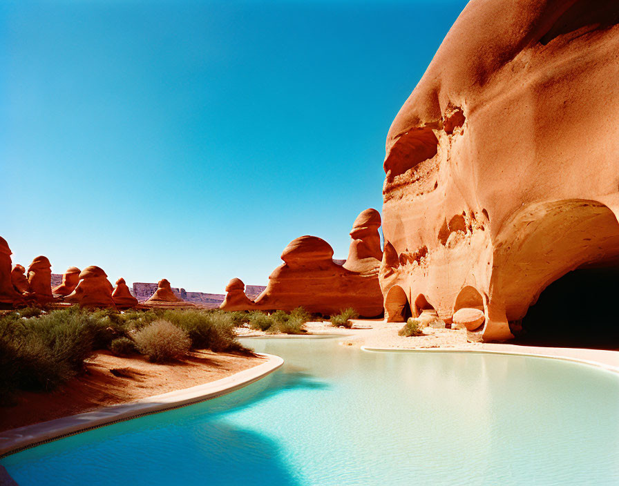 Tranquil Desert Oasis with Blue Pool and Sandstone Formations