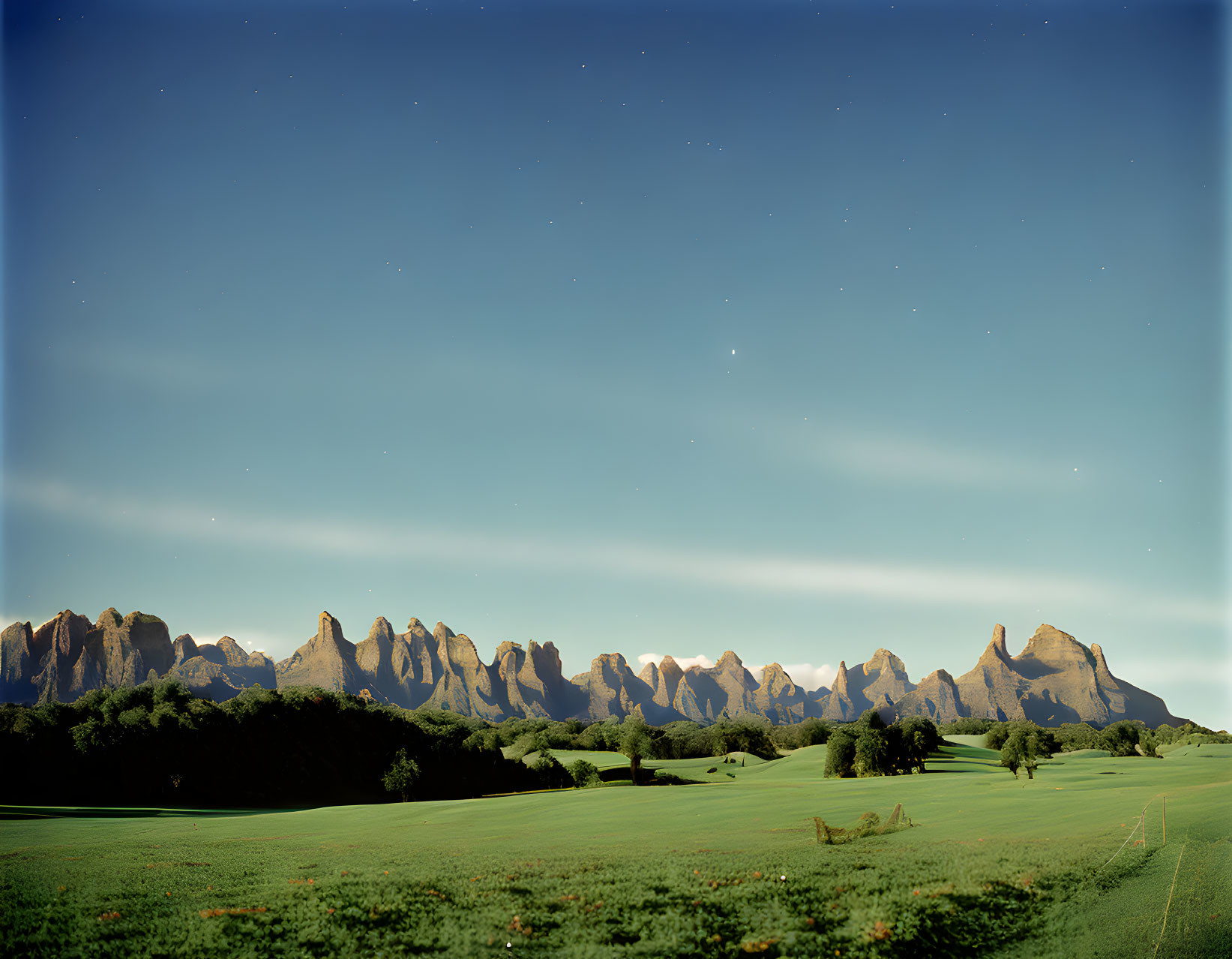 Mountain Range Landscape Transitioning from Day to Night Sky