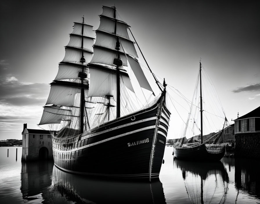 Monochrome image: Tall ships at dock under dramatic sky