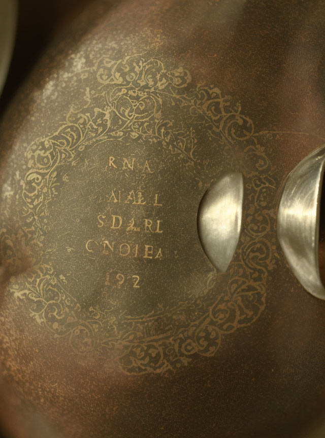 Detailed Engraved Brass Surface with 192 Year Inscription