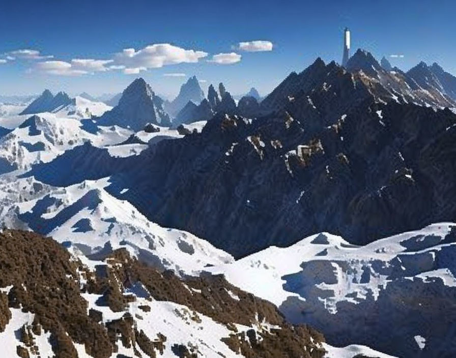 Snow-covered mountain peaks and monolith in panoramic view