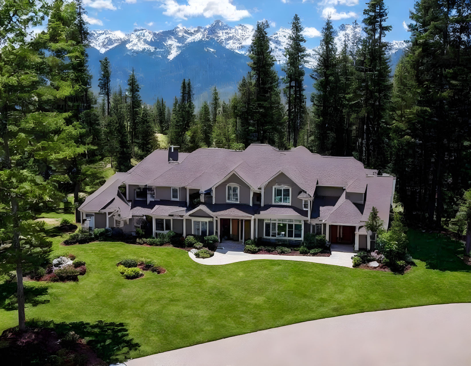 Spacious two-story house with landscaped gardens and mountain backdrop