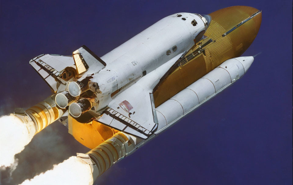 Space Shuttle Launch with Rocket Boosters Ignited in Blue Sky