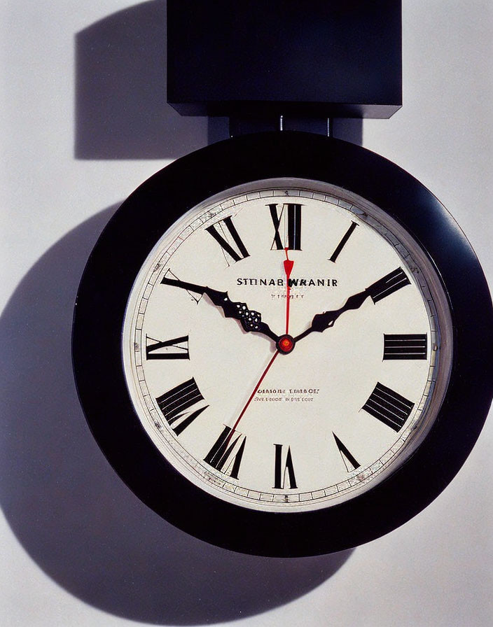 Elegant Wall Clock with Roman Numerals and Red Second Hand