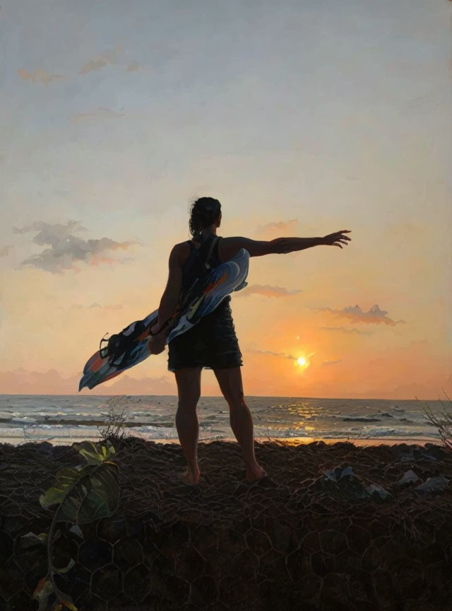 Surfer posing with surfboard on beach at sunset