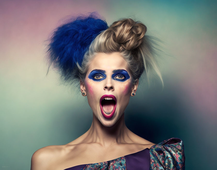 Woman with Dramatic Blue Updo and Intense Eye Makeup on Gradient Backdrop