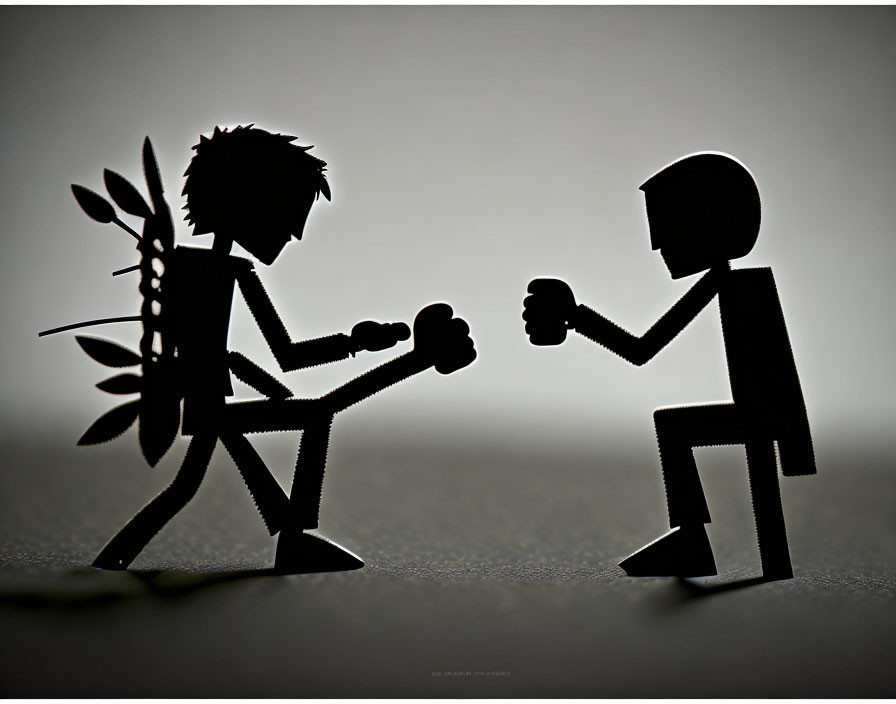Paper silhouette figures in boxing match pose with spiked and round heads.