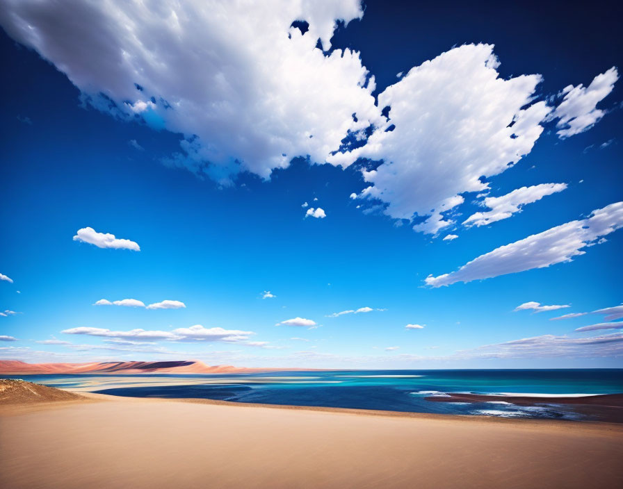 Tranquil beach scene with vivid blue sky and fluffy clouds