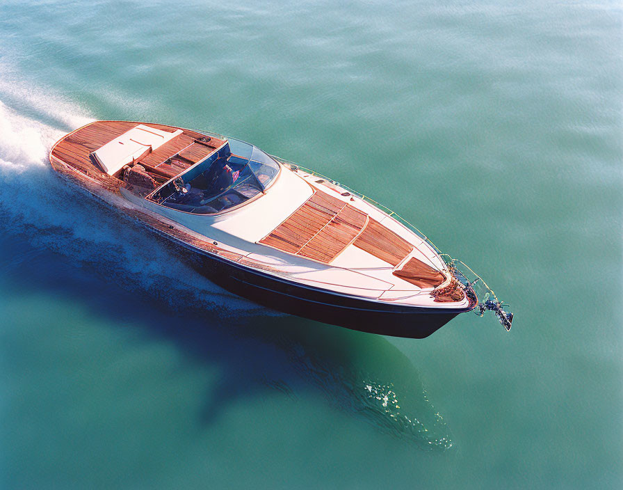 Luxury Speedboat with Wood Deck and Modern Design on Blue Water