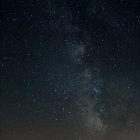 Starry night sky with Milky Way galaxy and shining stars.