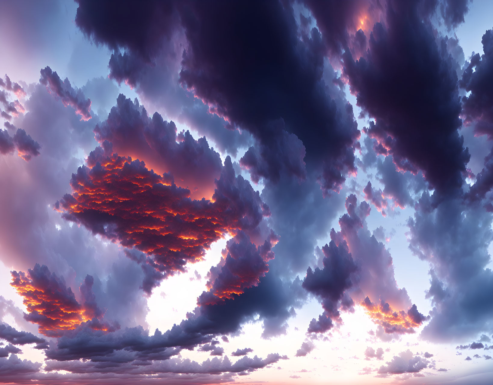 Vibrant crimson and indigo sunset clouds in dramatic sky