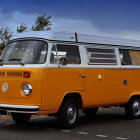 Vintage bus adorned with polka dots, fur, and lights in desert landscape