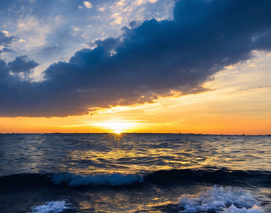 Vibrant Blue and Orange Sunset Over Ocean