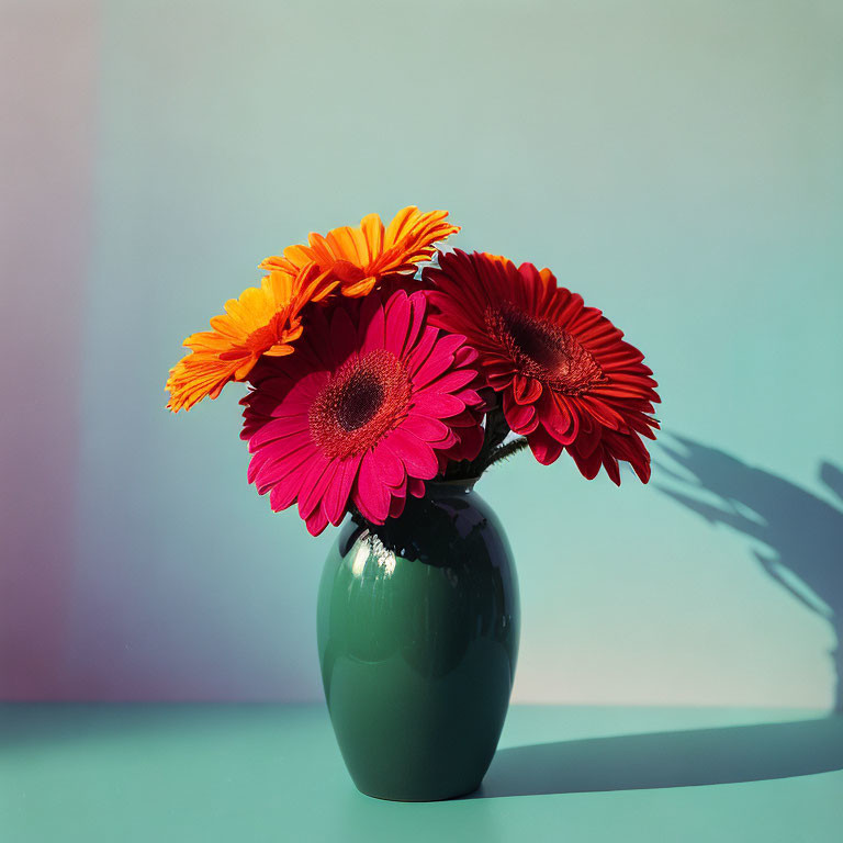 Colorful Gerbera Daisies in Orange and Pink Arrangement on Green Vase