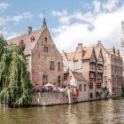 Scenic riverside village with clock tower and traditional houses