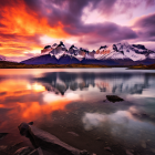 Surreal landscape with boats on tranquil waters under dramatic sky