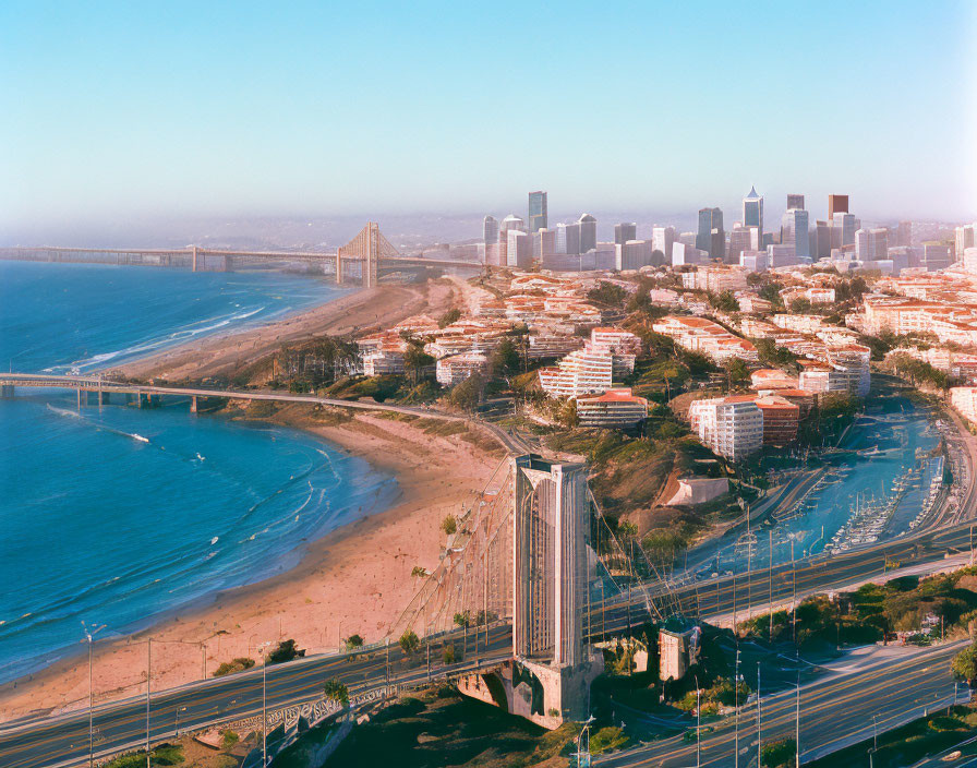 Coastal Cityscape with Beach, Bridge, Skyscrapers, and Highway