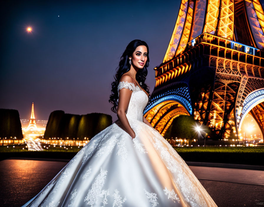 Bride in white gown poses at night with Eiffel Tower backdrop