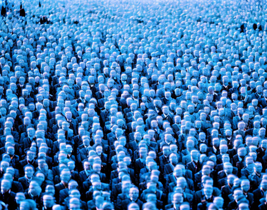 Crowded gathering forms sea of blue heads from above