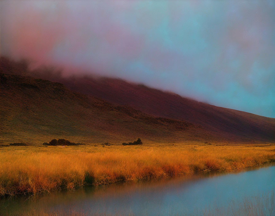 Tranquil river and twilight sky in serene landscape