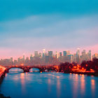 Cityscape with illuminated buildings, glowing bridge, and gradient sky