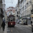 Detailed Art Nouveau Cityscape with Retrofuturistic Tram & Elegant Figures