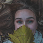 Portrait of a person with vibrant makeup and flowers.