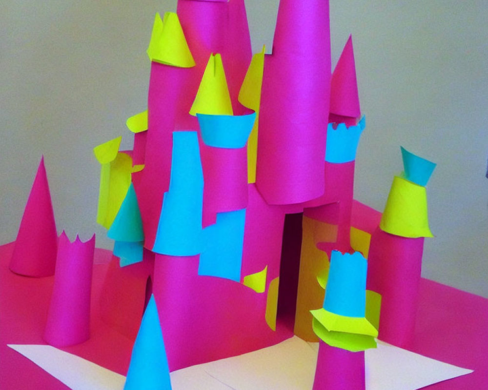 Vibrant paper sculpture with pink and neon yellow cone-shaped towers