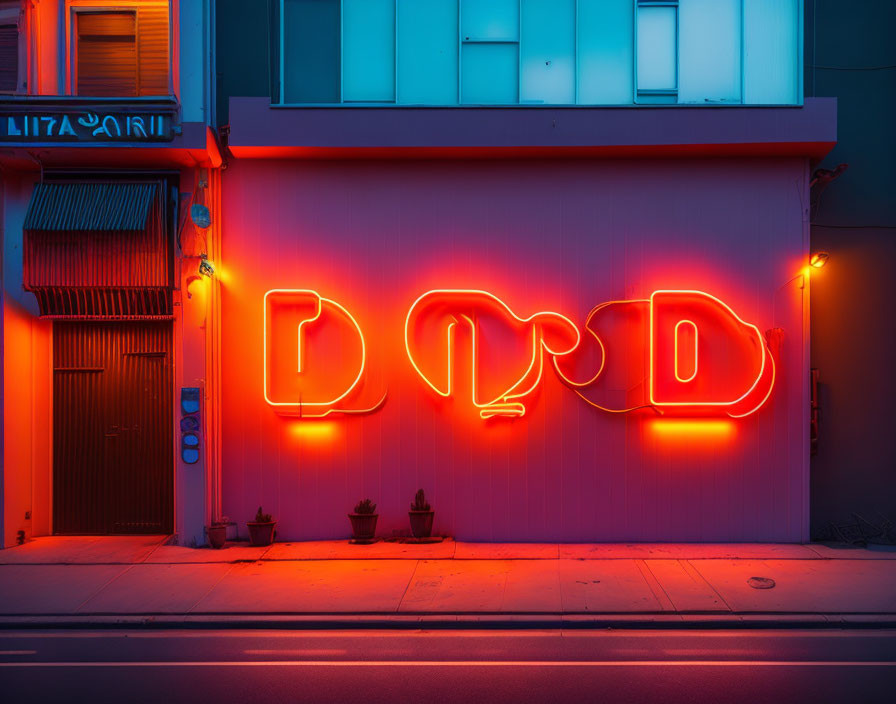 Neon "D2D" sign glowing red on building facade at twilight