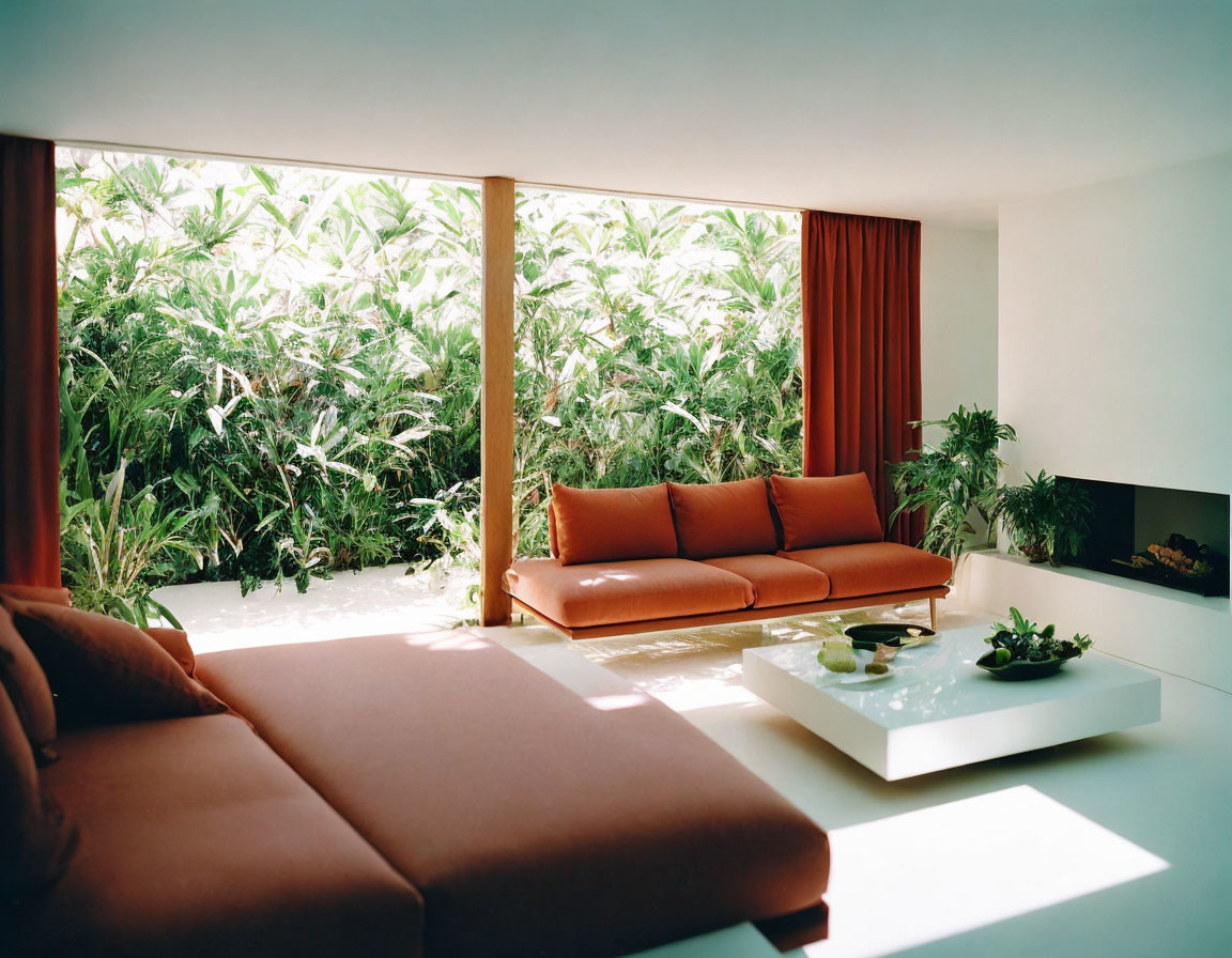 Minimalist living room with large window, brown sofa, white table, red curtains