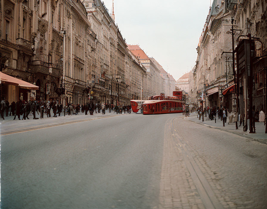 Vintage city street scene with red tram, pedestrians, and old buildings under cloudy sky