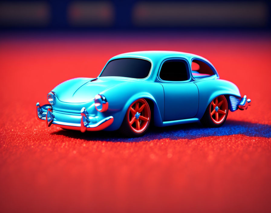 Miniature Blue Vintage Car with Orange Highlights and Chrome Detailing on Vibrant Red Textured Surface