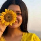 Woman Holding Sunflower in Digital Illustration