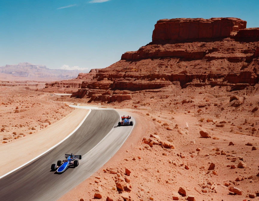 Two racing cars in desert landscape with red rocks and blue sky