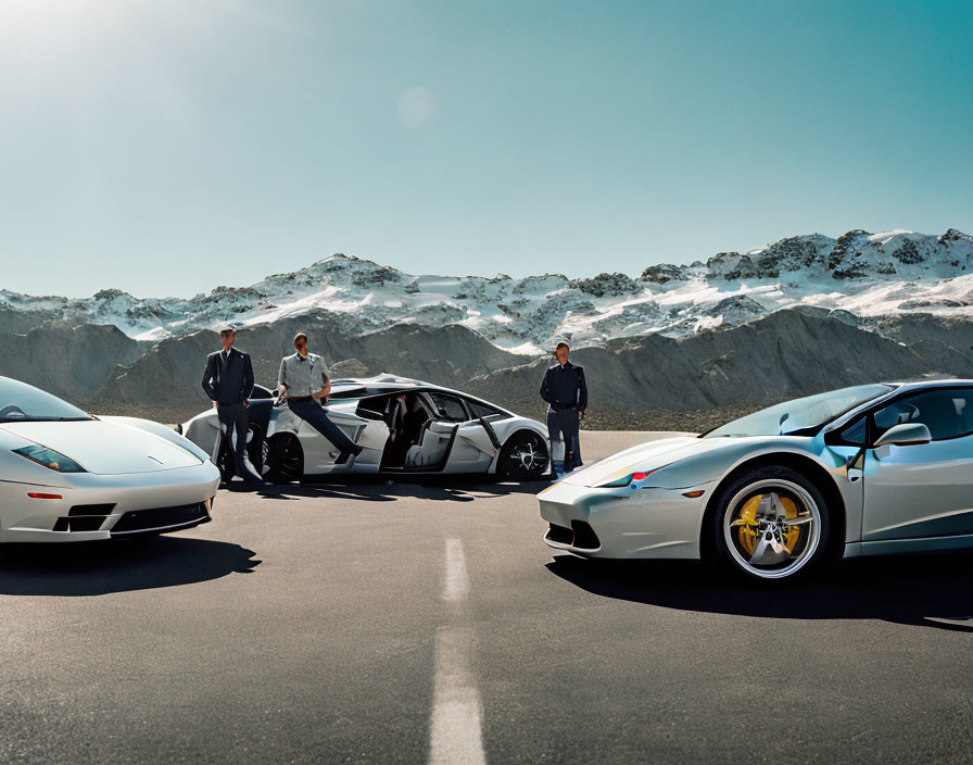 Three individuals in suits with luxury sports cars on open road with snowy mountains